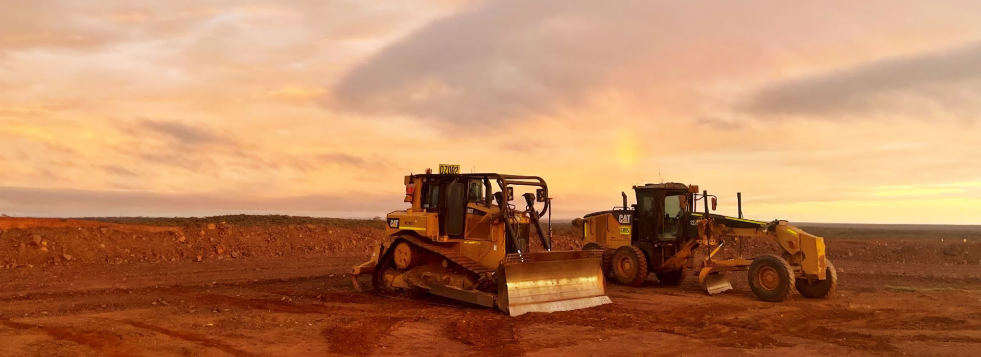 sunrise at Mount Jackson with red dirt and heavy machinery